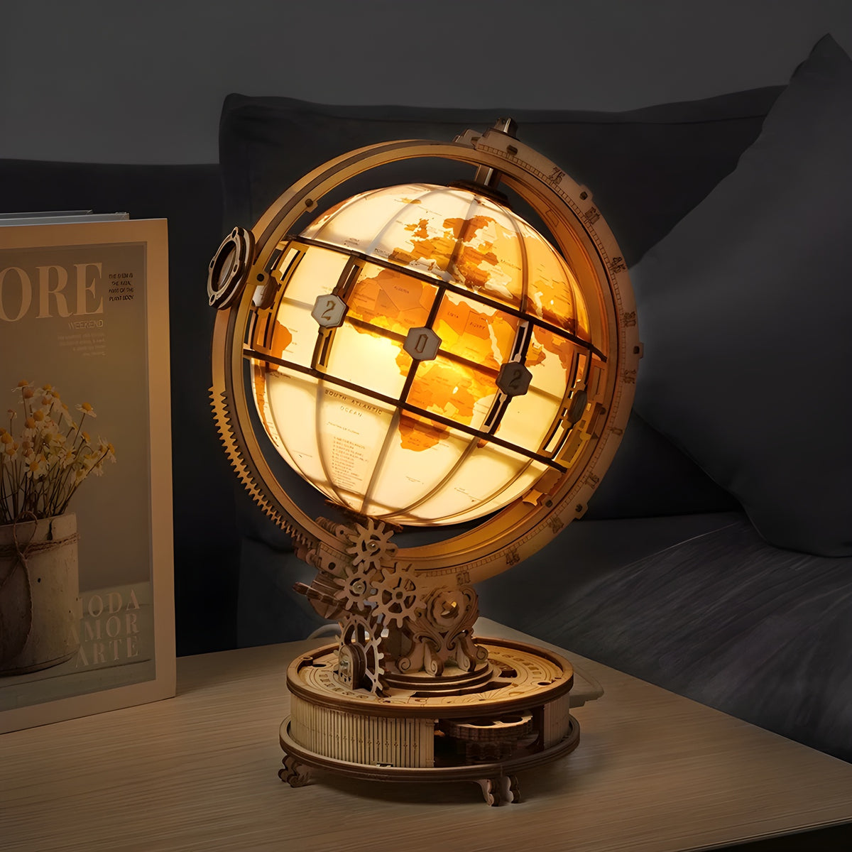3D Wooden Light-Up Globe Puzzle glowing warm on a bedside table