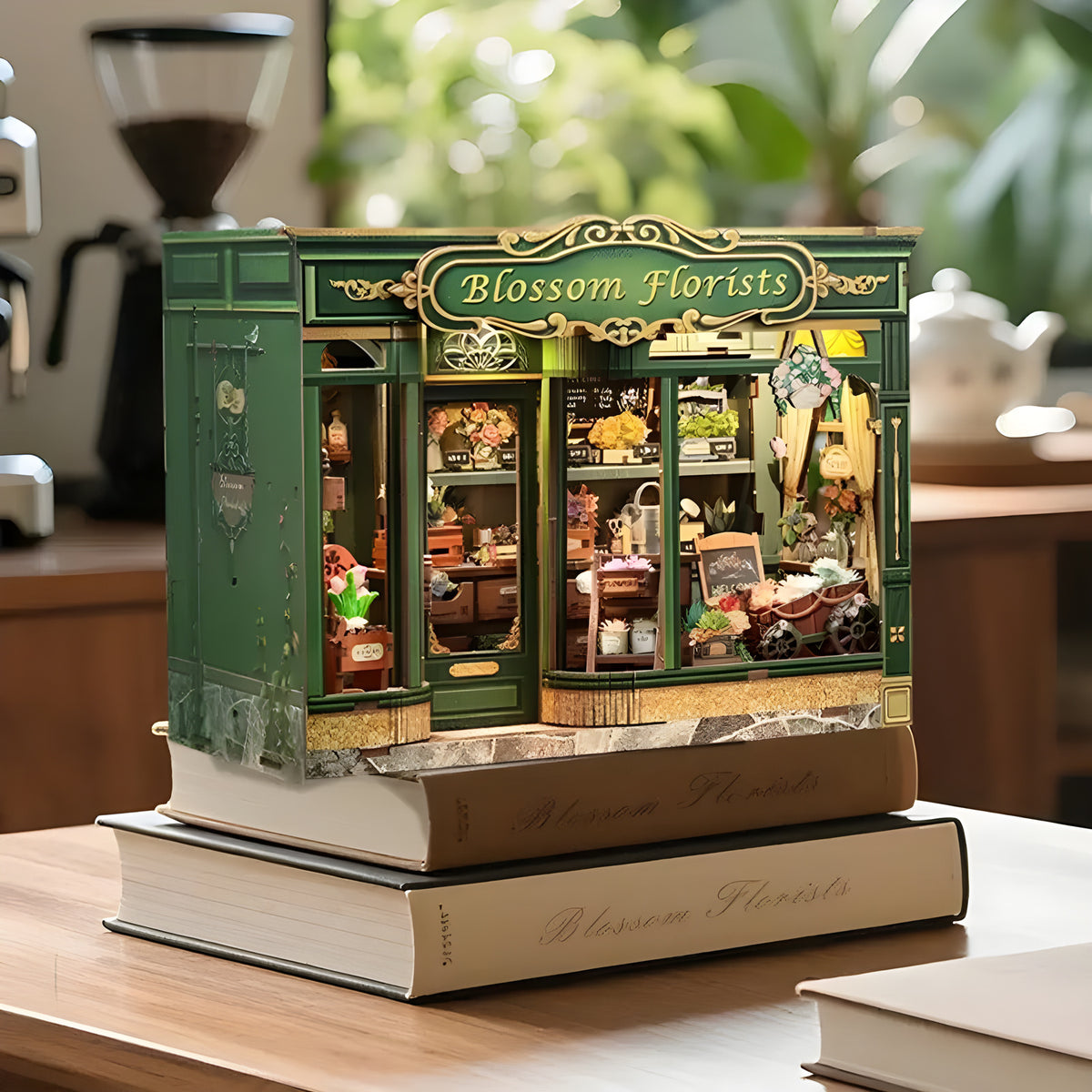 Blossom Florists DIY book nook lit on a stack of books