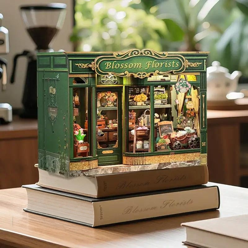 Blossom Florists DIY book nook lit on a stack of books
