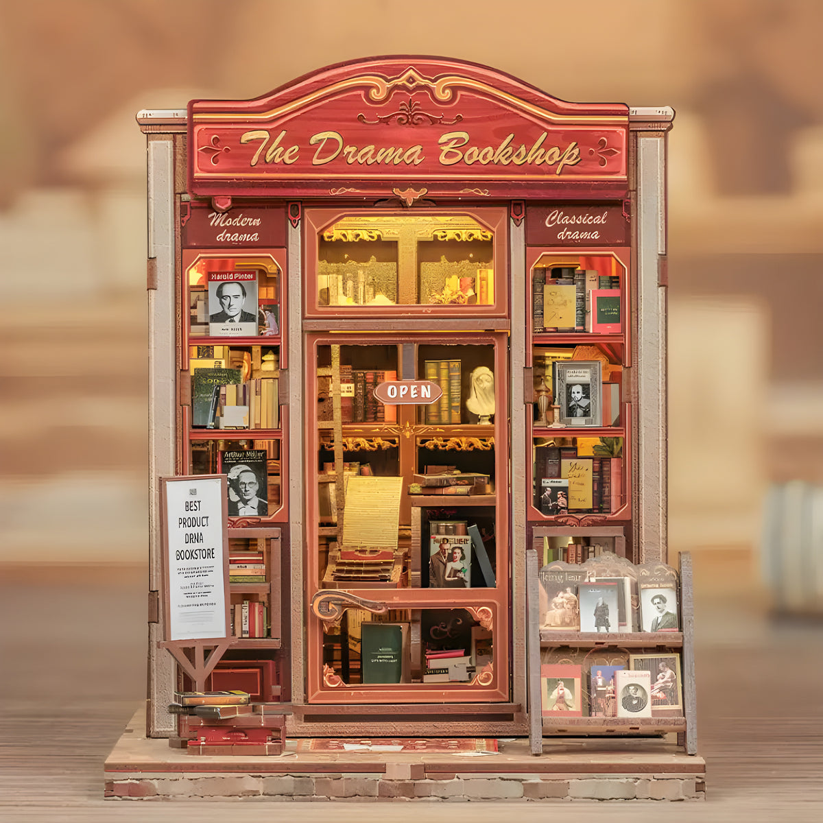 Drama Bookshop DIY book nook kit. Miniature wooden theatrical bookstore diorama with curtains, vintage books, theater posters, and warm LED lighting. Designed to slide between books on a bookshelf.