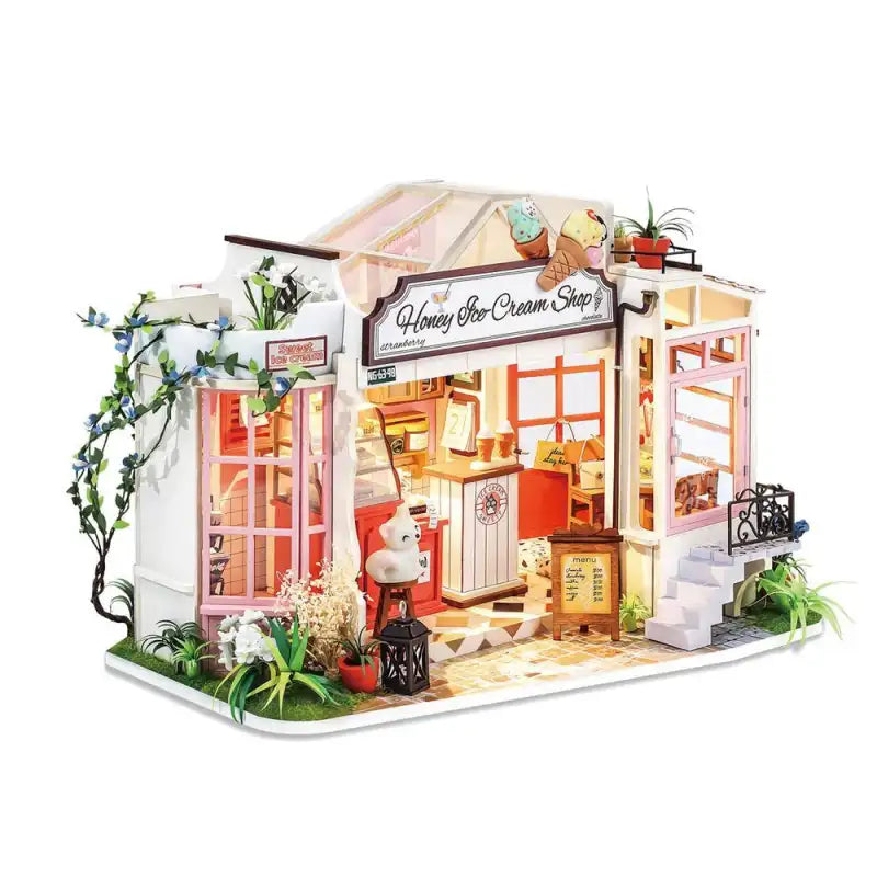 Honey Ice Cream Shop DIY miniature house kit. Wooden model of a sweet ice cream parlor with display counter, pastel decor, and warm LED lighting.