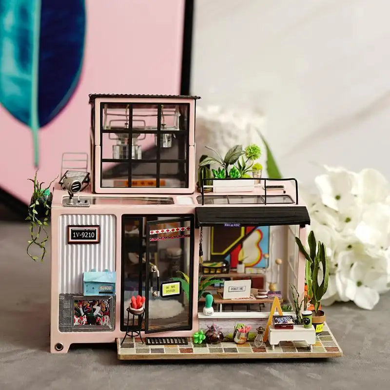 Kevin's Bachelor Studio DIY miniature house kit. Modern luxury wooden loft model with private music studio, rooftop garden, sleek furniture, and three hanging LED ceiling lights. Fully furnished and assembled from scratch.