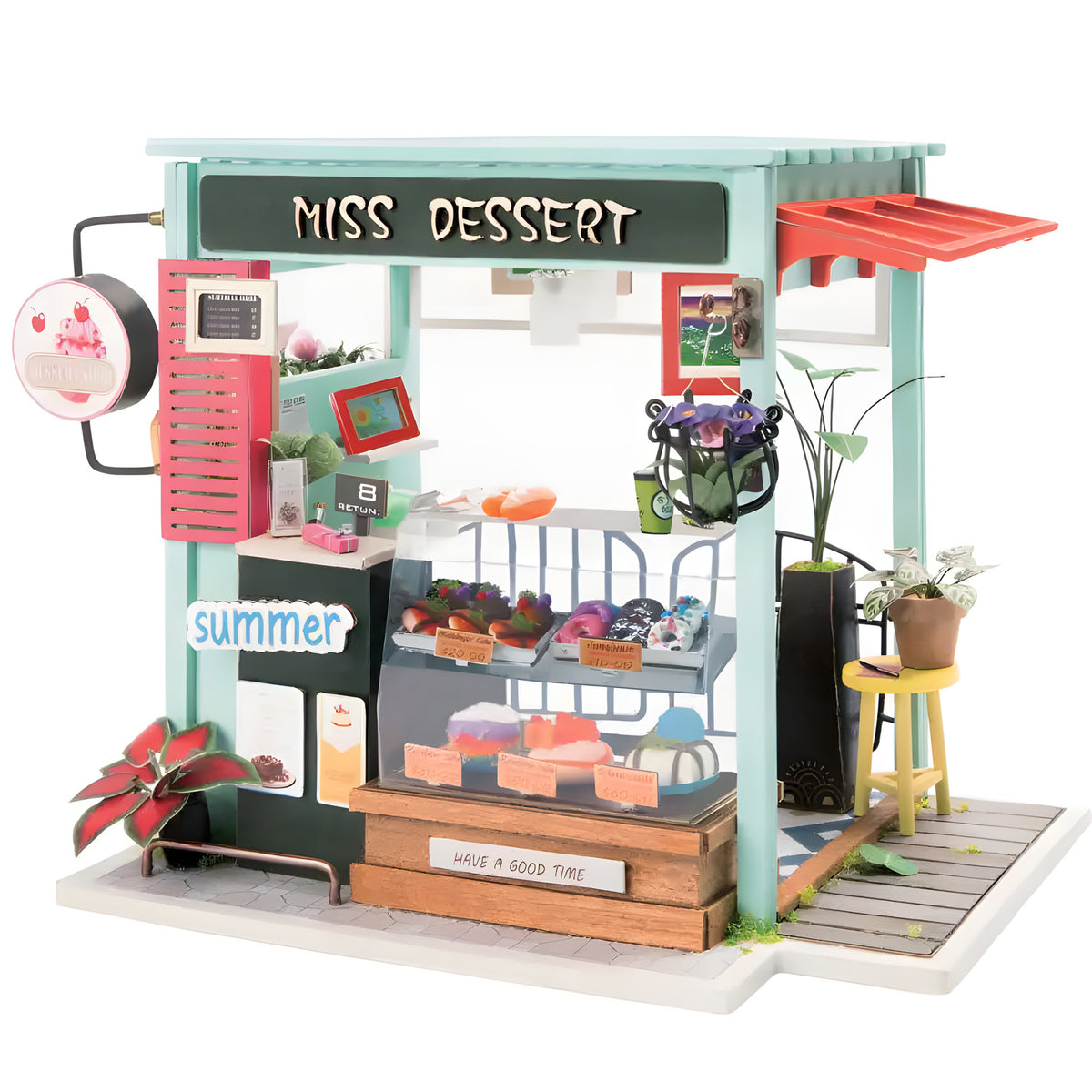 Miss Dessert Shop DIY miniature house kit. Wooden model of a charming pastry shop with cakes display, pink decor, vintage details, and warm LED lighting.