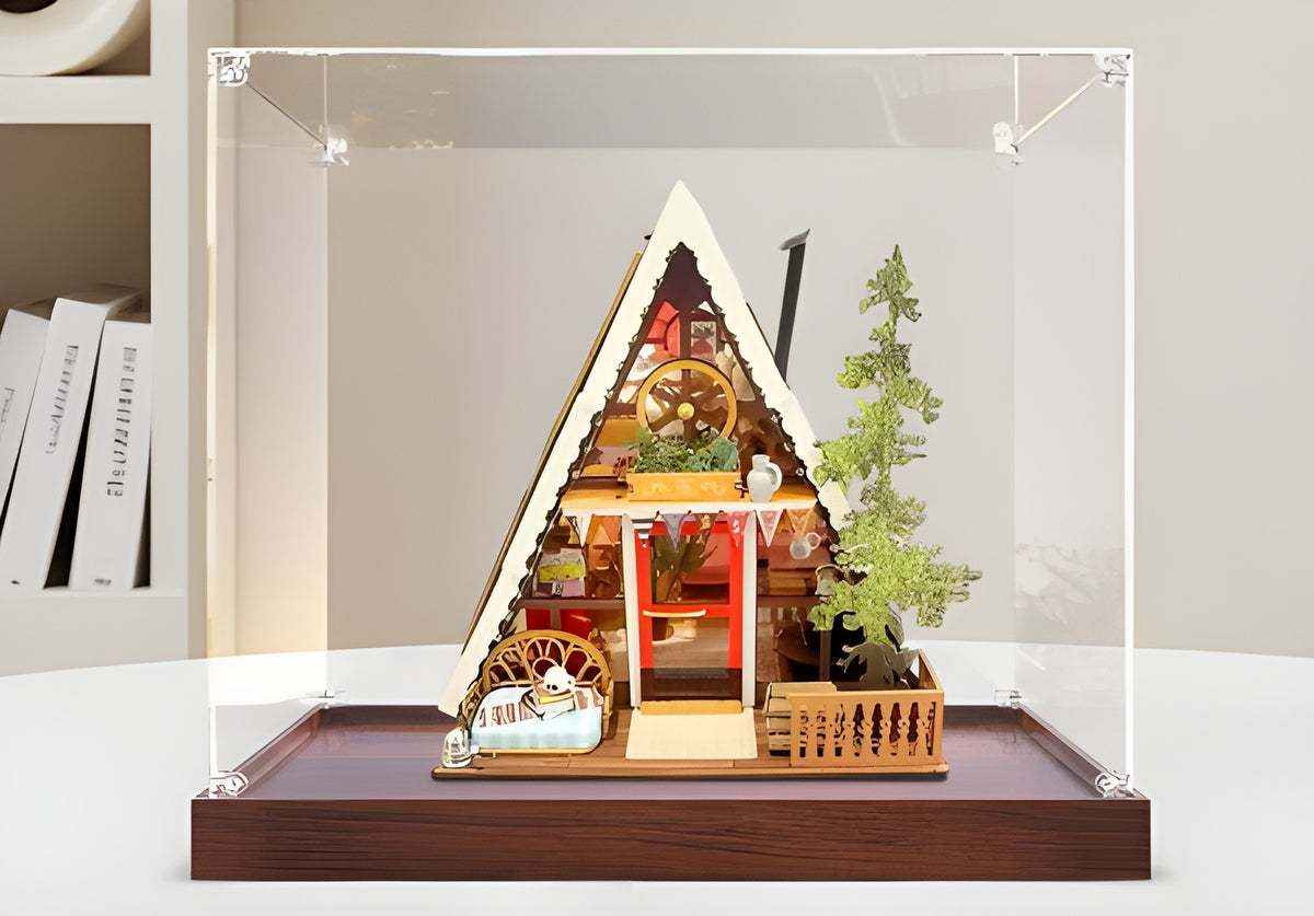 Miniature house display case without light, clear acrylic case on a dark wood base
