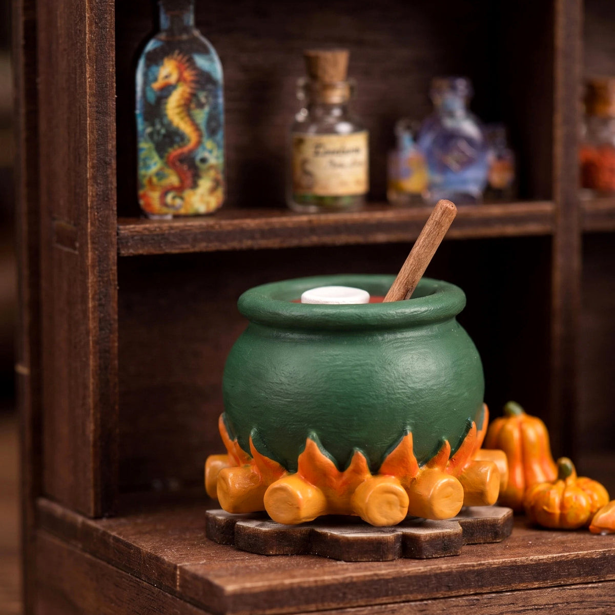 Close-up of the green cauldron over the fire