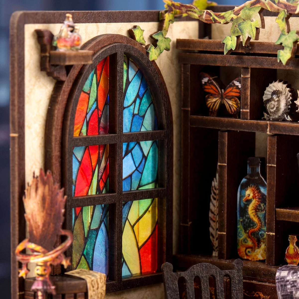 Close-up of the stained glass arched window and shelves