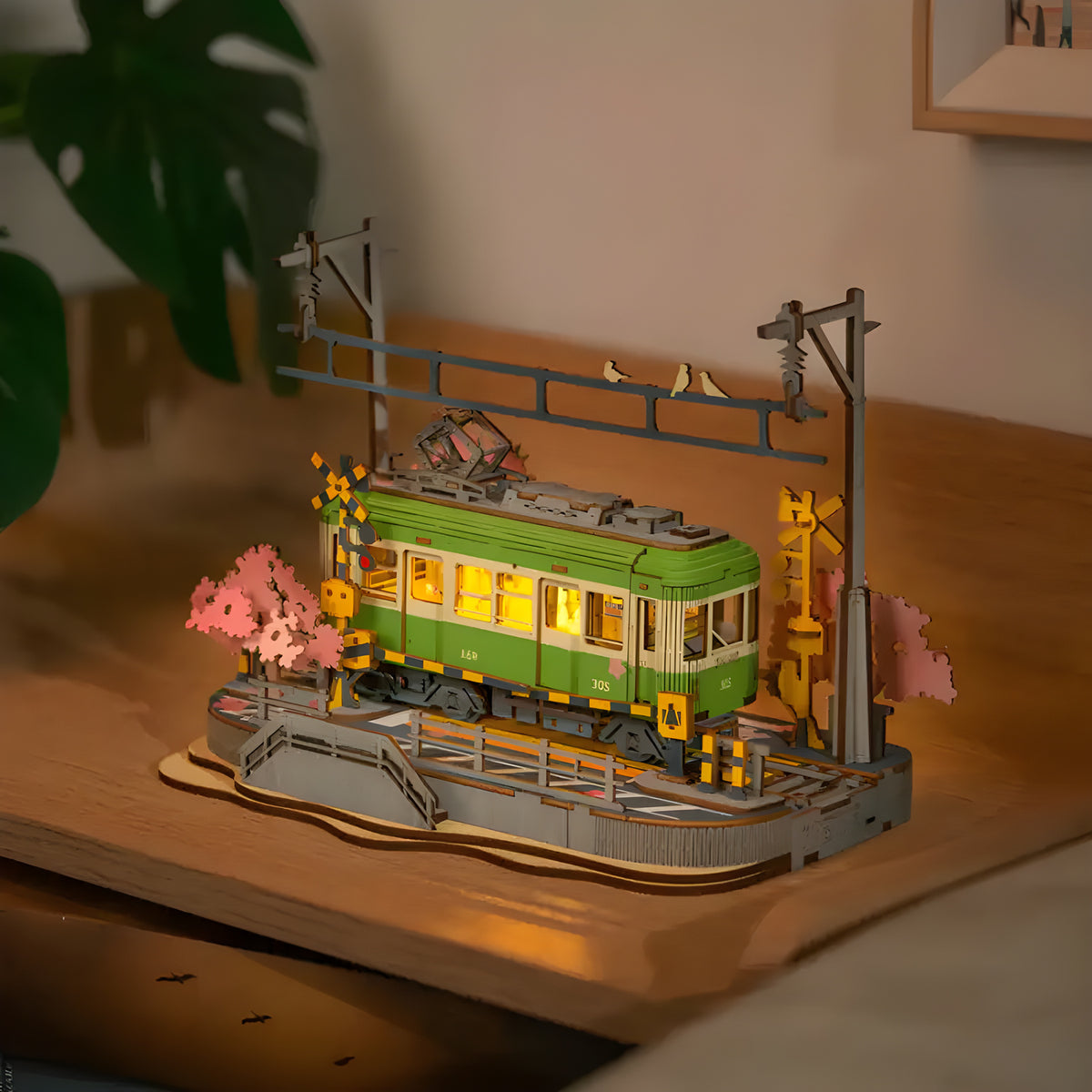 Sakura Journey 3D wooden puzzle. Wooden model of a Japanese train passing through cherry blossom landscape with intricate details. A beautiful collectible DIY build.