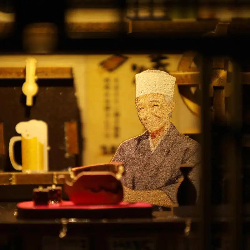 Izakaya counter with beer tap and chef figure